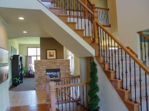 Foyer with stairs looking on to fireplace
