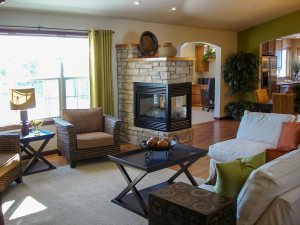 Living room with fireplace extending out from wall