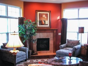 Cozy living room with red accent wall and fireplace